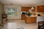 Kitchen, facing north (the street, sliding door behind)