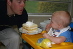 Daddy showing Will how to blow out the candle