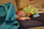 Daddy lets me nap on the couch while mommy is at dinner.