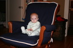 Will sitting in our glider, and making it 'rock' on his own.